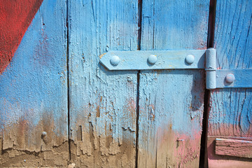detail of an old wooden door with blue paint