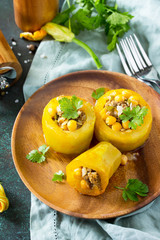 Healthy food: Baked Zucchini Stuffed - with chickpea and Meat on a stone or slate background. Diet menu.