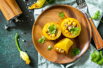 Healthy food: Baked Zucchini Stuffed - with chickpea and Meat on a stone or slate background. Diet menu. Top view flat lay background.