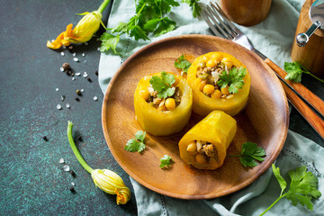 Healthy food: Baked Zucchini Stuffed - with chickpea and Meat on a stone or slate background. Diet menu. Copy space.