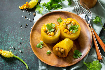 Healthy food: Baked Zucchini Stuffed - with chickpea and Meat on a stone or slate background. Diet menu.