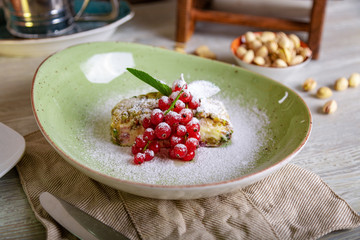 Close up view of beautiful elegant sweet dessert served on the plate. Beautiful decoration, restaurant dish, ready to eat. Tea time, cozy atmosphere.
