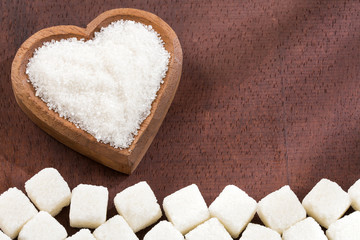Fototapeta na wymiar White granulated sugar and refined sugar. Top view