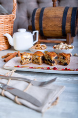 Close up view of beautiful elegant sweet dessert served on the plate. Beautiful decoration, restaurant dish, ready to eat. Tea time, cozy atmosphere.