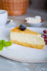 Close up view of beautiful elegant sweet dessert served on the plate. Beautiful decoration, restaurant dish, ready to eat. Tea time, cozy atmosphere.