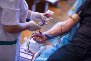 Blood donation hand. Nurse hands - obrazy, fototapety, plakaty