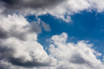 Fototapeta na wymiar Puffy Clouds on Blue Sky Background