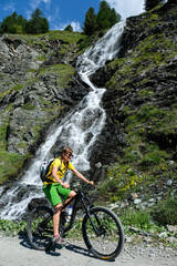 Fototapeta premium mountainbiker in action in the beautiful aosta valley, Italy, Europe