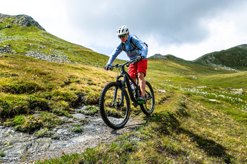 mountainbiker in action in the beautiful aosta valley, Italy, Europe - obrazy, fototapety, plakaty