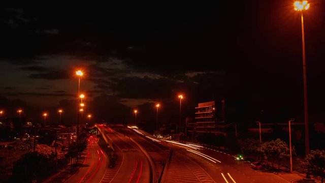 4k time lapse, Car lights In traffic at dusk before a rain storm.
