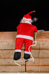 Santa trying to climb the wall
