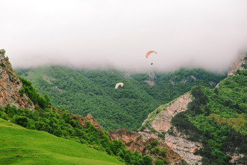 Beautiful landscape with paragliders.