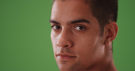 Obraz premium Close up portrait of handsome Hispanic man on green screen