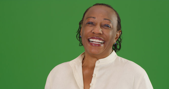 Happy Mature Black Woman Laughing On Green Screen