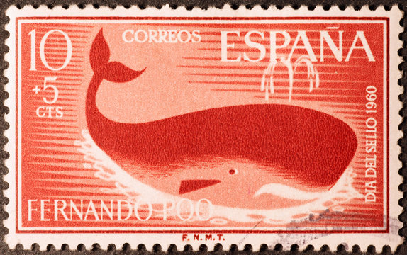 Stylized whale on old spanish postage stamp