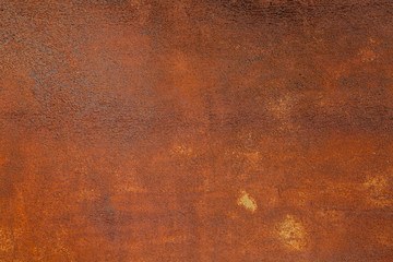 Rusty yellow-red textured metal surface. The texture of the metal sheet is prone to oxidation and...
