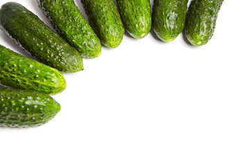 Fresh green cucumbers on white background with copy space. Gherkin