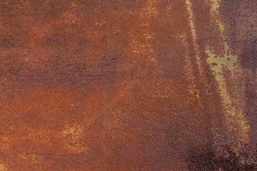 Rusty yellow-red textured metal surface. The texture of the metal sheet is prone to oxidation and corrosion. Textured Background in Grunge Style