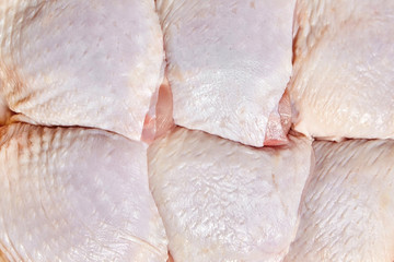 Raw and uncooked chicken thighs. Meat of poultry background