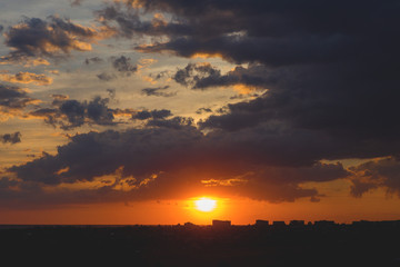 Beautiful atmospheric dramatic clouds in the evening at sunset.