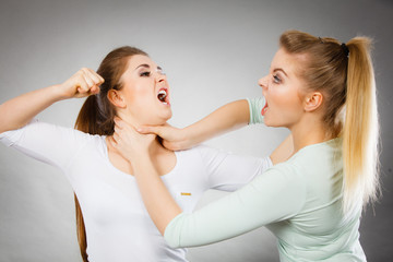 Two agressive women having argue fight
