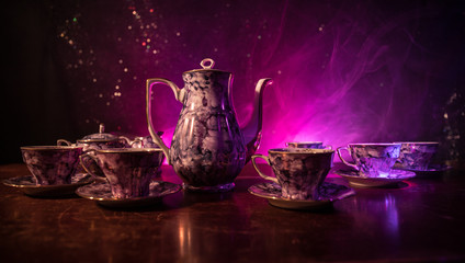 Food background tea and coffee theme. Old vintage ceramic tea or coffee pot with cups jug and sugar...