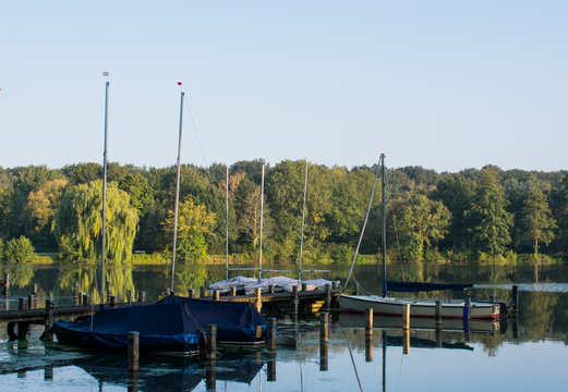 Boat dock with sailboats in the early morning. Location: Germany, North Rhine Westphalia, Hoxfeld