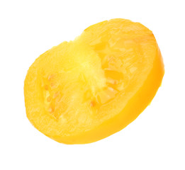 Slice of yellow tomato on white background