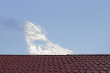 Roof tiles on sky background