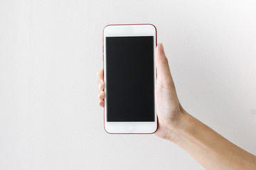 woman's hands holding smart phone