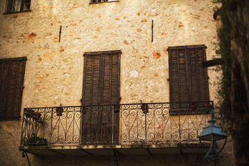 Plakat Facade of the Old Building with a Openwork Balcony. Beautiful Refined Old Balcony. France.