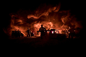 War Concept. Military silhouettes fighting scene on war fog sky background, World War Soldiers Silhouettes Below Cloudy Skyline At night. Attack scene. Army jeep vehicles with soldiers. army jeep