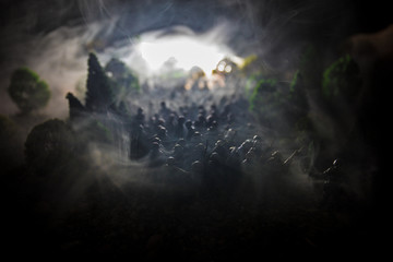 War Concept. Military silhouettes fighting scene on war fog sky background, World War Soldiers Silhouettes Below Cloudy Skyline At night. Attack scene. Selective focus Tanks battle. Decoration