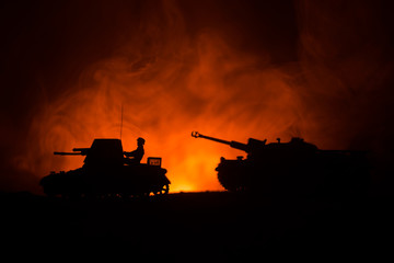 War Concept. Military silhouettes fighting scene on war fog sky background, World War German Tanks...