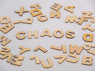 Top down view on wooden letters with the word chaos