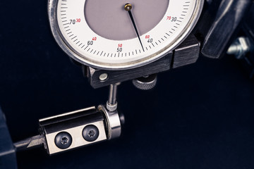 Dial gauge when measuring endmill with ball bearing. Close-up of measurement by probe indicator in...