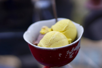 ice cream in bowl on wooden table