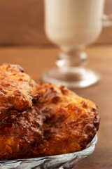 Breakfast of cottage cheese homemade cookies with milk, wooden background, close-up.