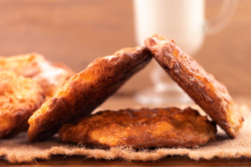 Thin home-made cookies, laid in the form of a house on a linen napkin.