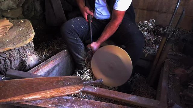 Carpenter Woodworking, detail of a worker with a lathe, shaping wood, etara, bulgaria