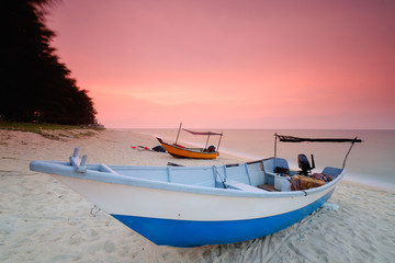 Fishing boats  is parked on the beach during beautiful sunset  at Kampung Mangkuk, Terengganu, Malaysia