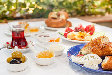 Turkish tea, Cheese, Honey, Jam,  Olives, Simit. Authentic turkish breakfast. Local cuisine concept