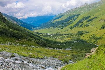 Fototapeta na wymiar Aerial view from the drone. The valley of the river flowing from the Sofia waterfalls, Lower Arkhyz, Karachay Cherkess Republic.