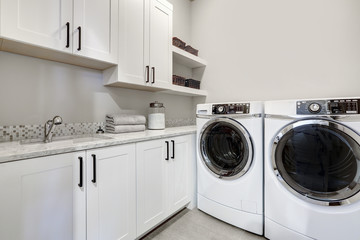 White clean modern laundry room with washer and dryer - obrazy, fototapety, plakaty
