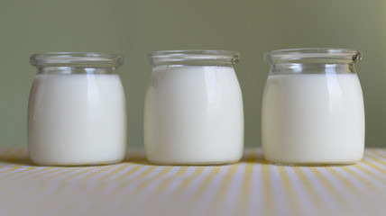 three jars of yogurt