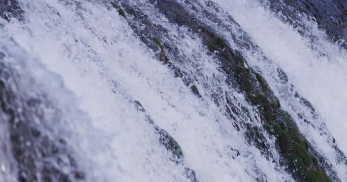 wild river waterfall with fresh drinking water closeup slow motion calm relaxing backgrond