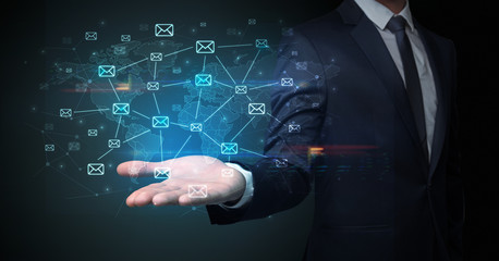 Elegant businessman holding communication concept on his hand 