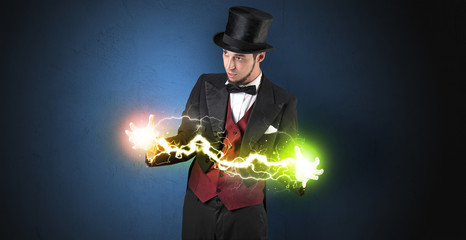 Magician sparkling super power between his two hands