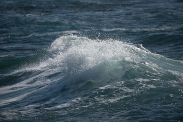 Fototapeta premium Strong wave splashing on sea