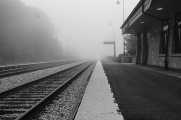 Naklejka na ściany i meble Train station in the fog